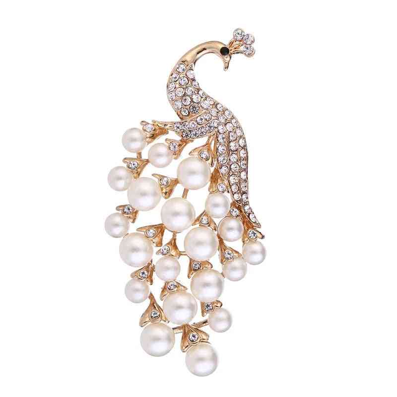 Elegante broche con ramo de perlas y pavo real