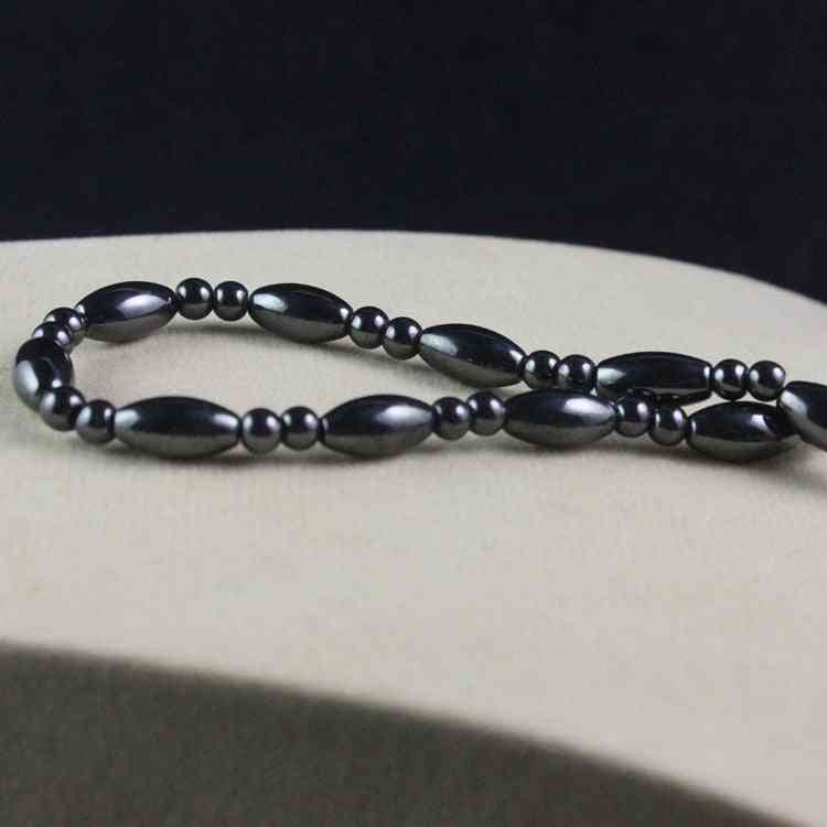 Halskette aus ovalen Perlen aus magnetischem Hämatit