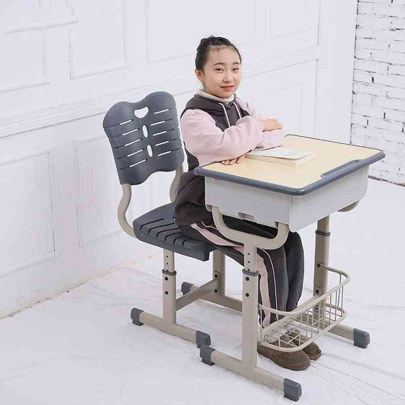 Justerbart skrivebord og stole med blyantspalte