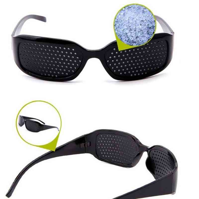 Synskorrektionsforbedrende stenopeiske nålehulsbriller til øjenpleje